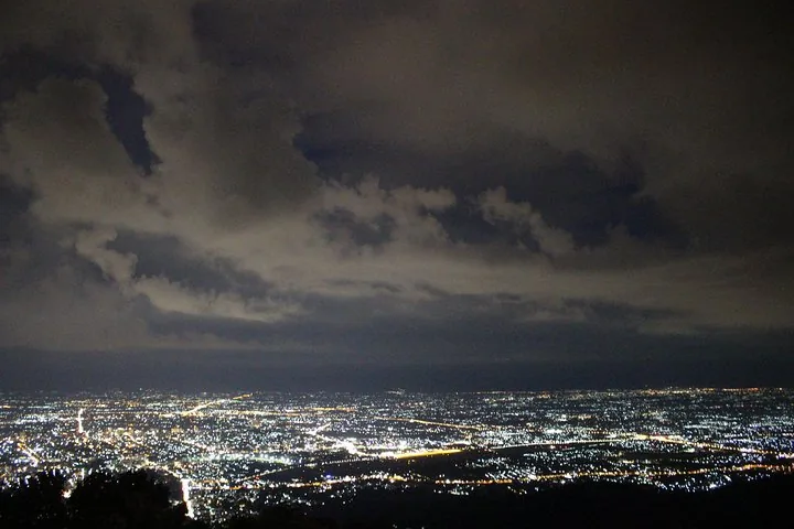 Panoramic night view of Chiang Mai city from a high vantage point